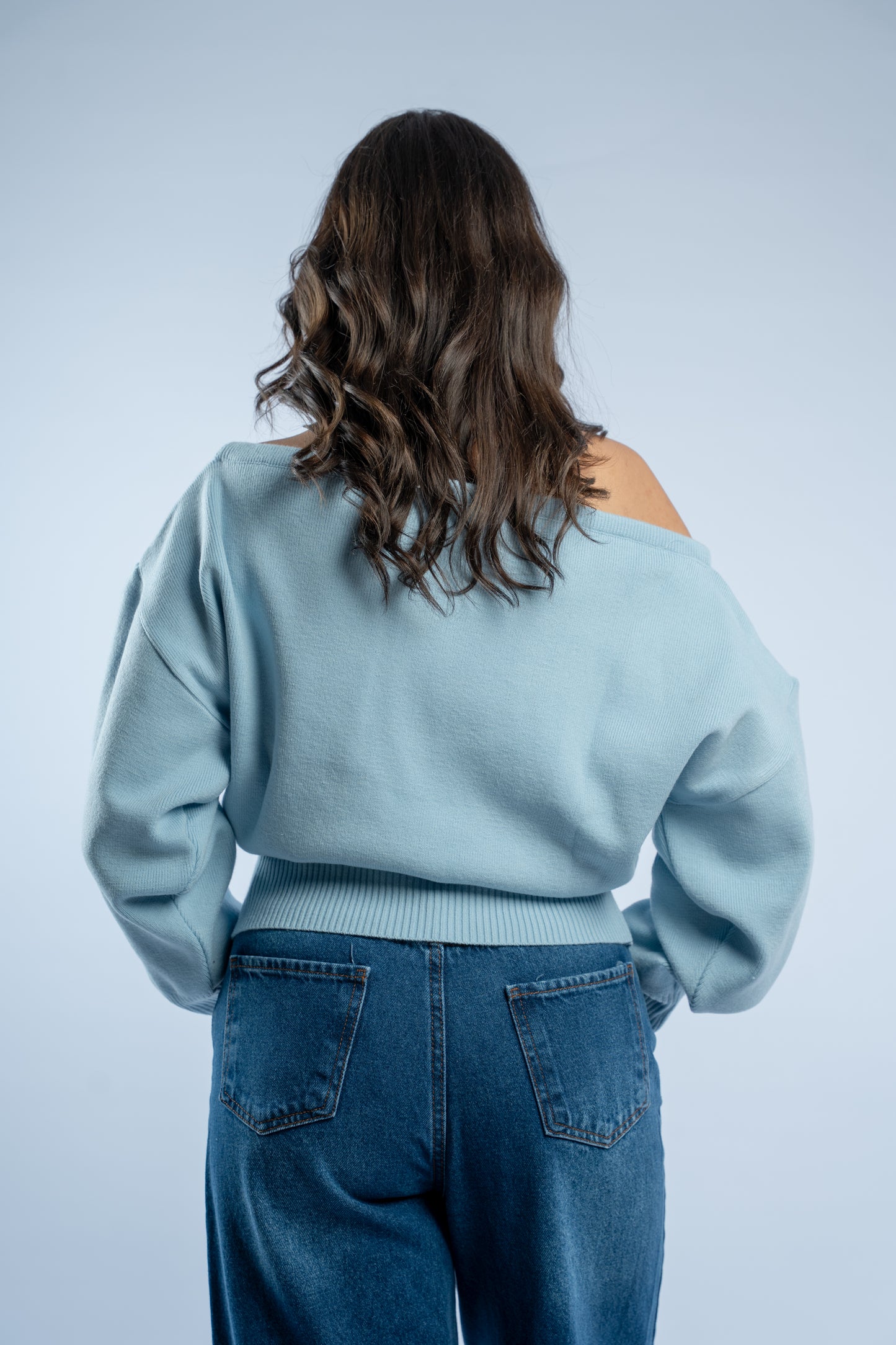 Asymmetrical waist-defined knit top