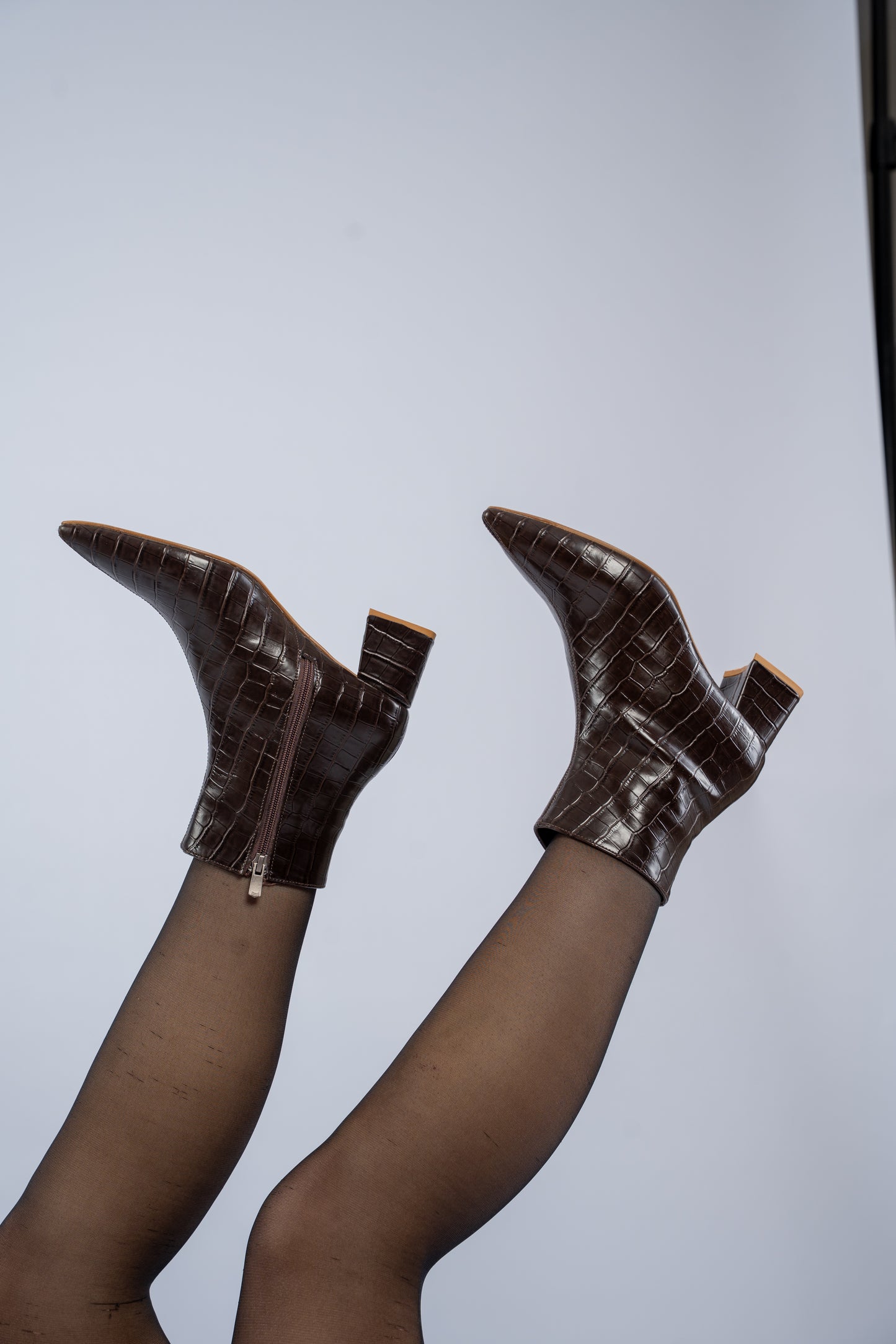The pointed heel ankle boots