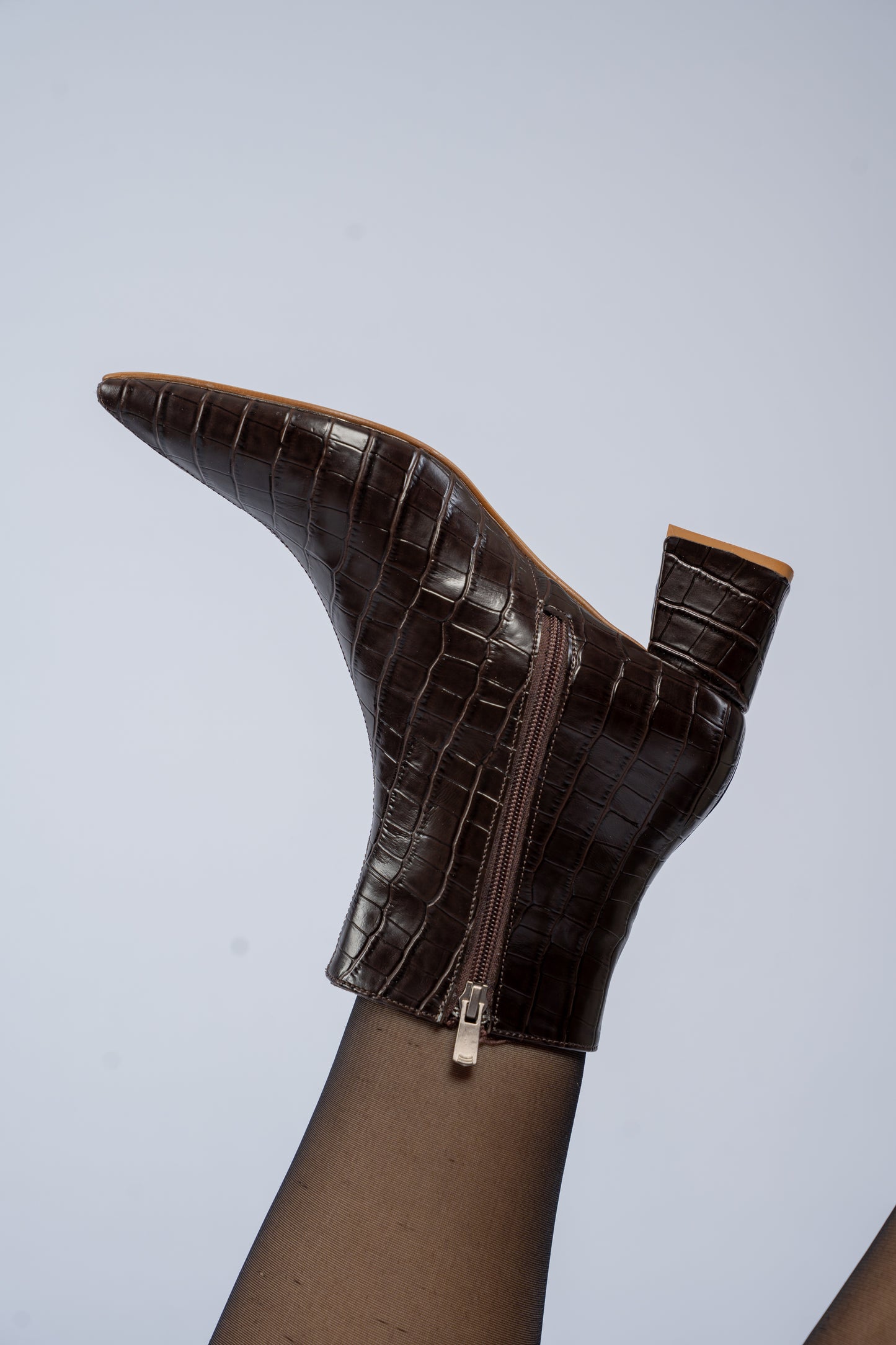 The pointed heel ankle boots