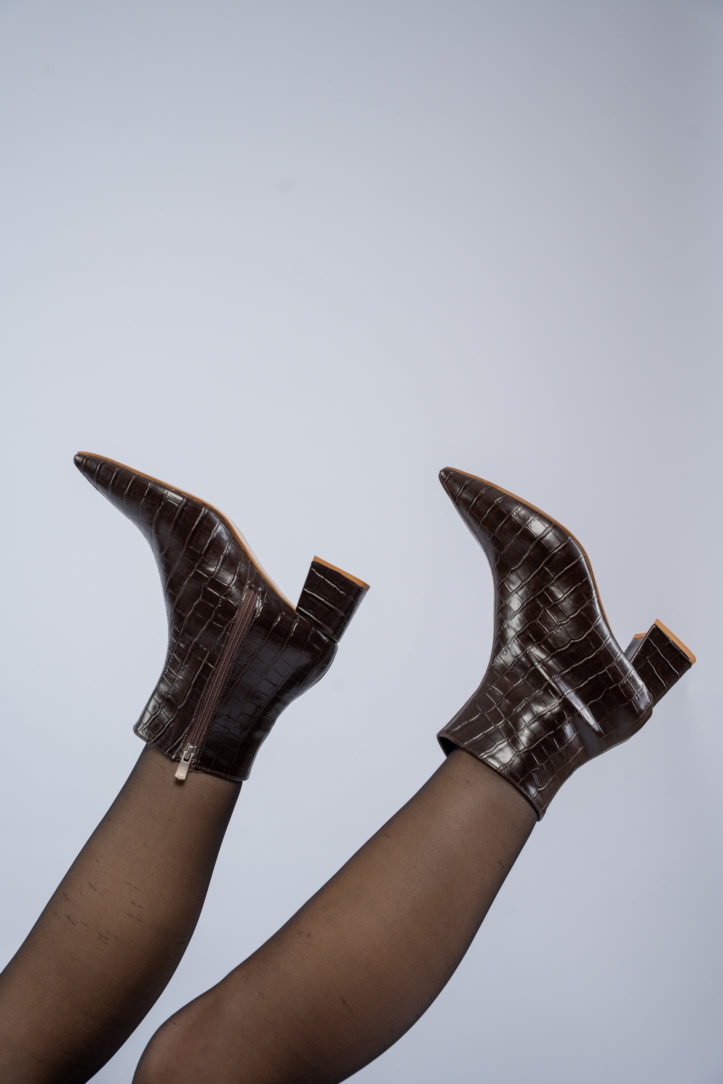 The pointed heel ankle boots