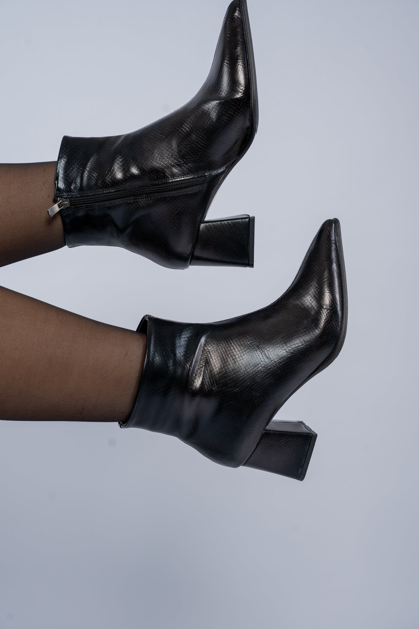 The pointed heel ankle boots
