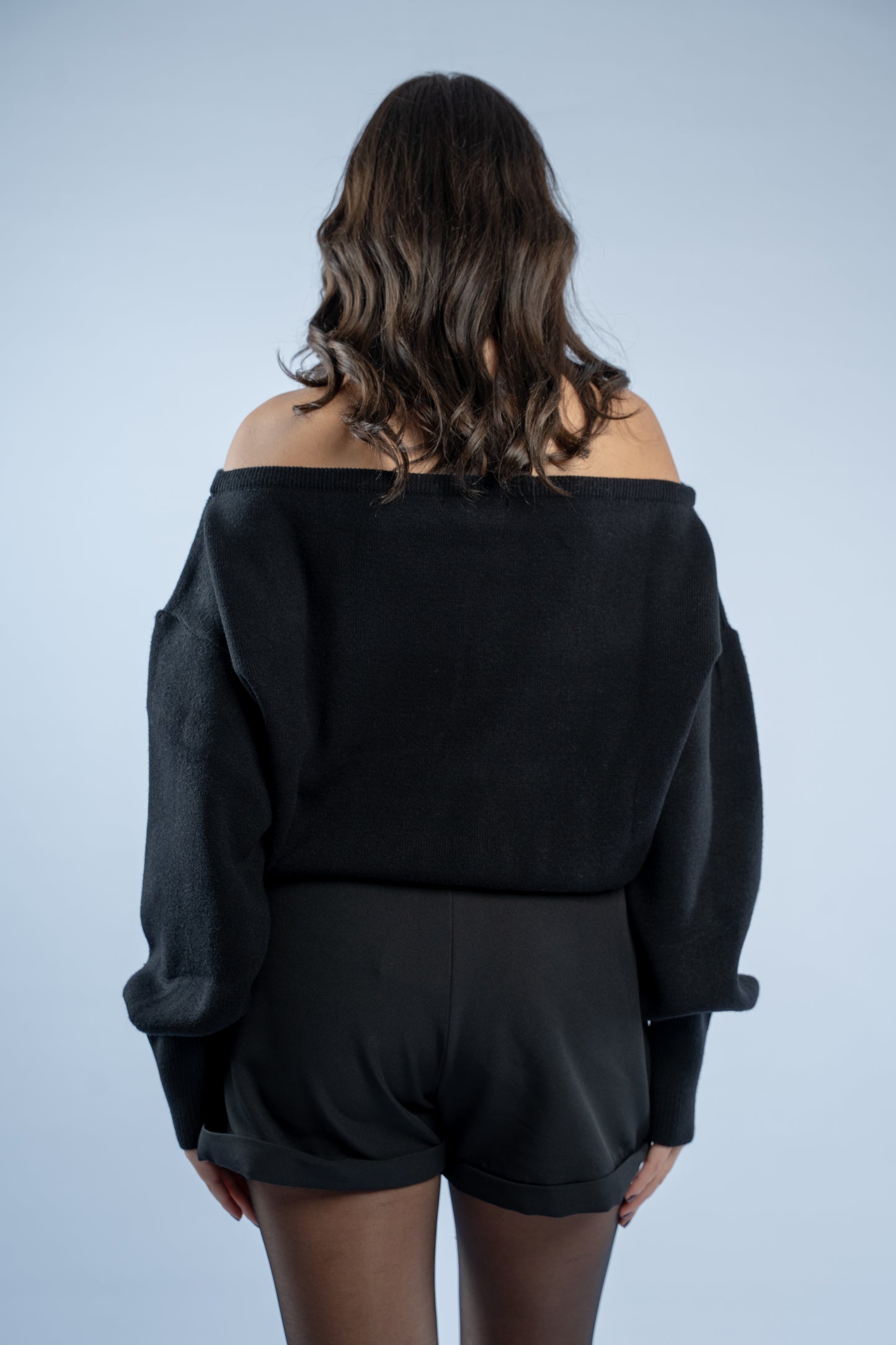Asymmetrical waist-defined knit top