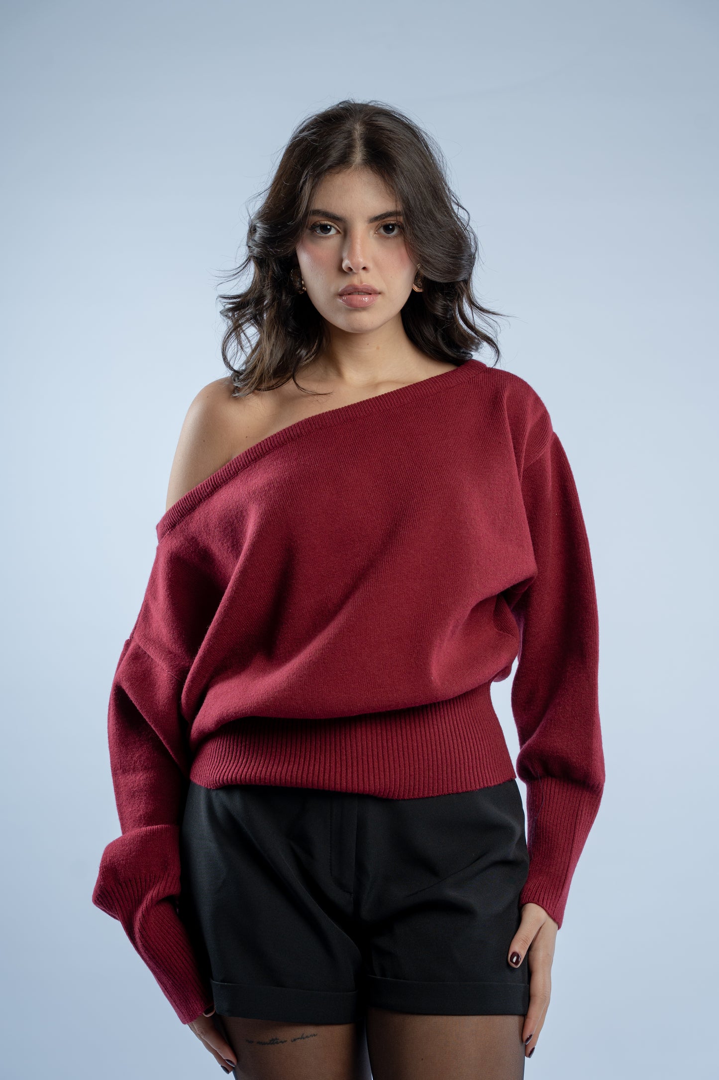 Asymmetrical waist-defined knit top