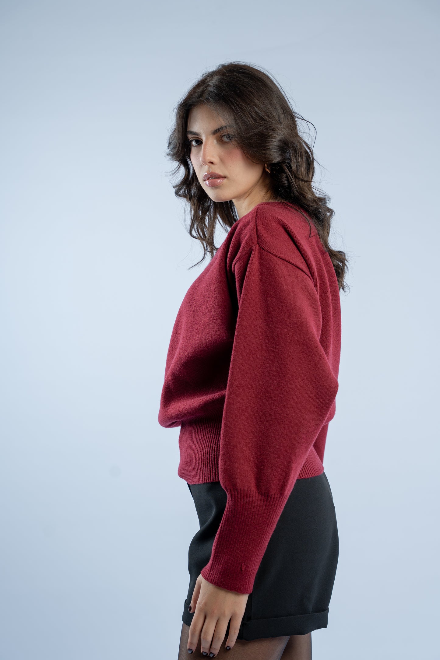 Asymmetrical waist-defined knit top