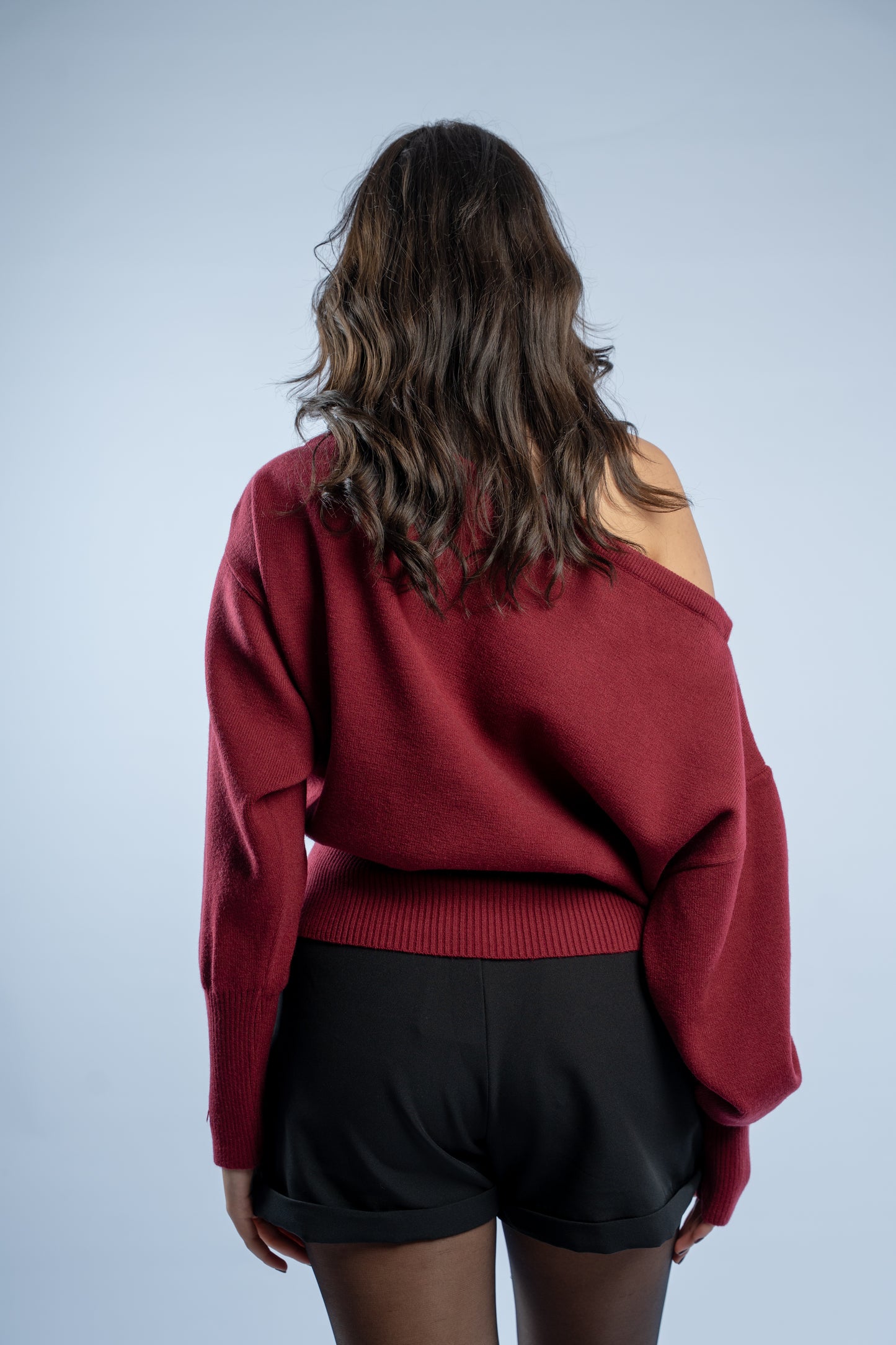 Asymmetrical waist-defined knit top