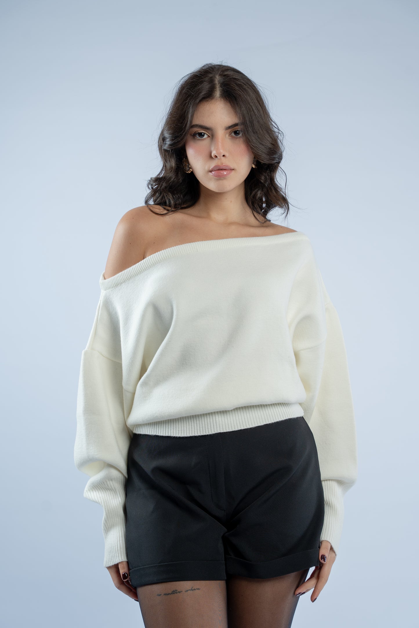 Asymmetrical waist-defined knit top