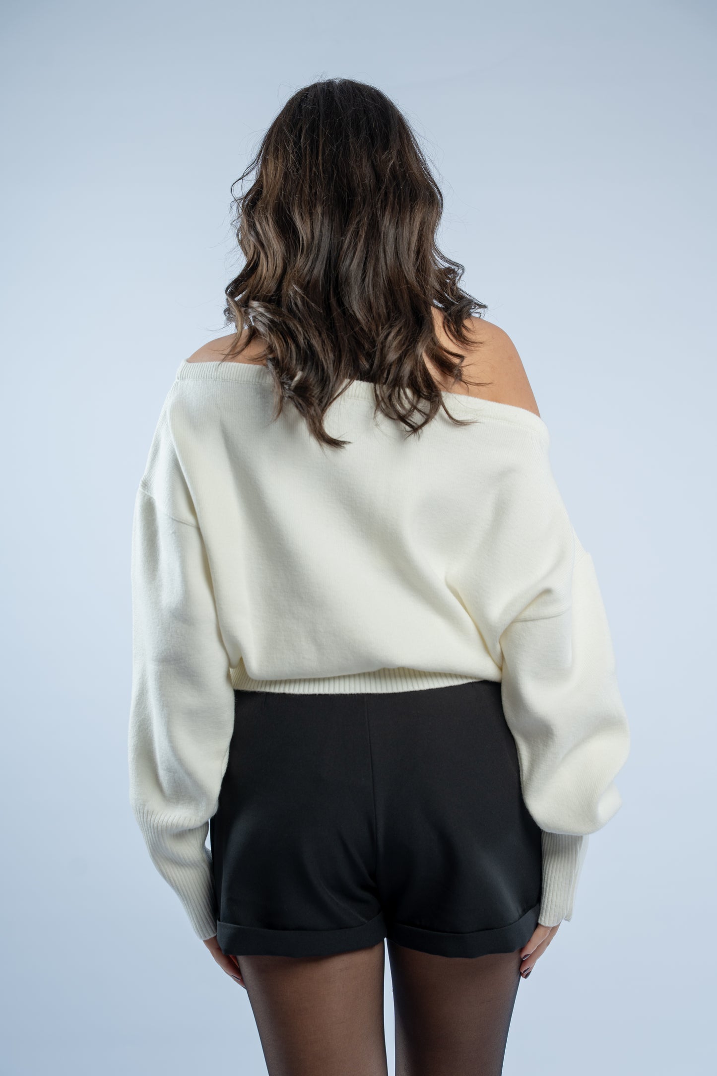 Asymmetrical waist-defined knit top