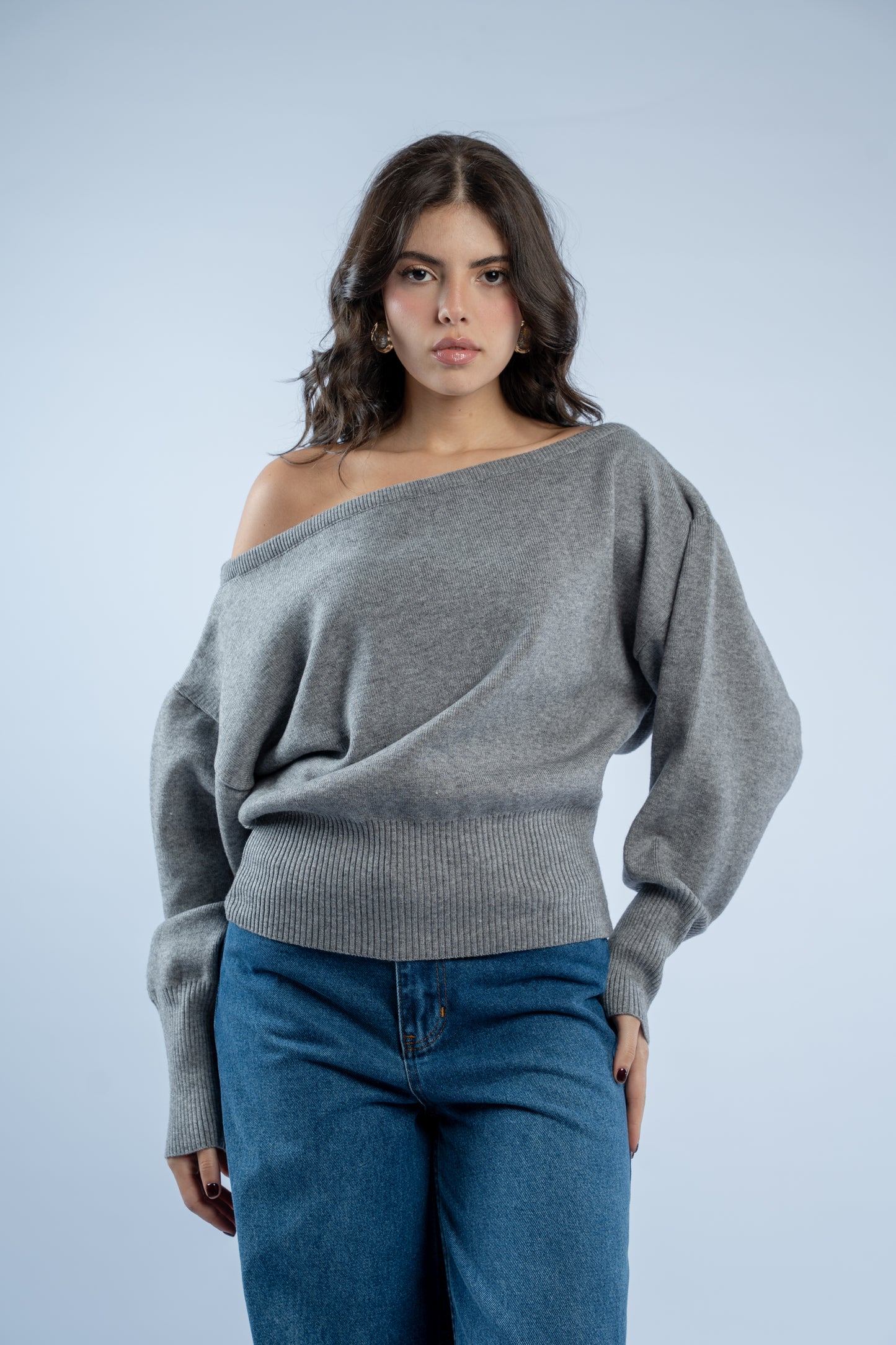 Asymmetrical waist-defined knit top