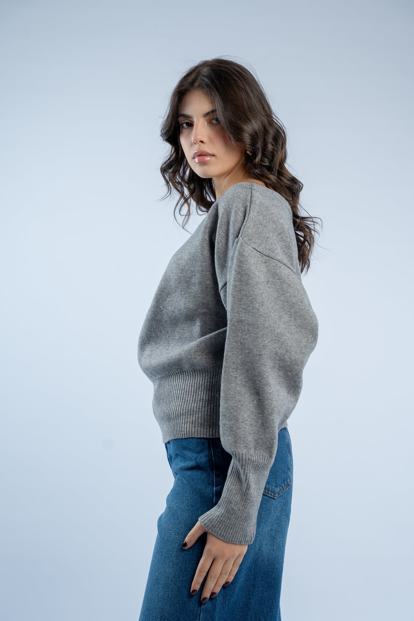 Asymmetrical waist-defined knit top