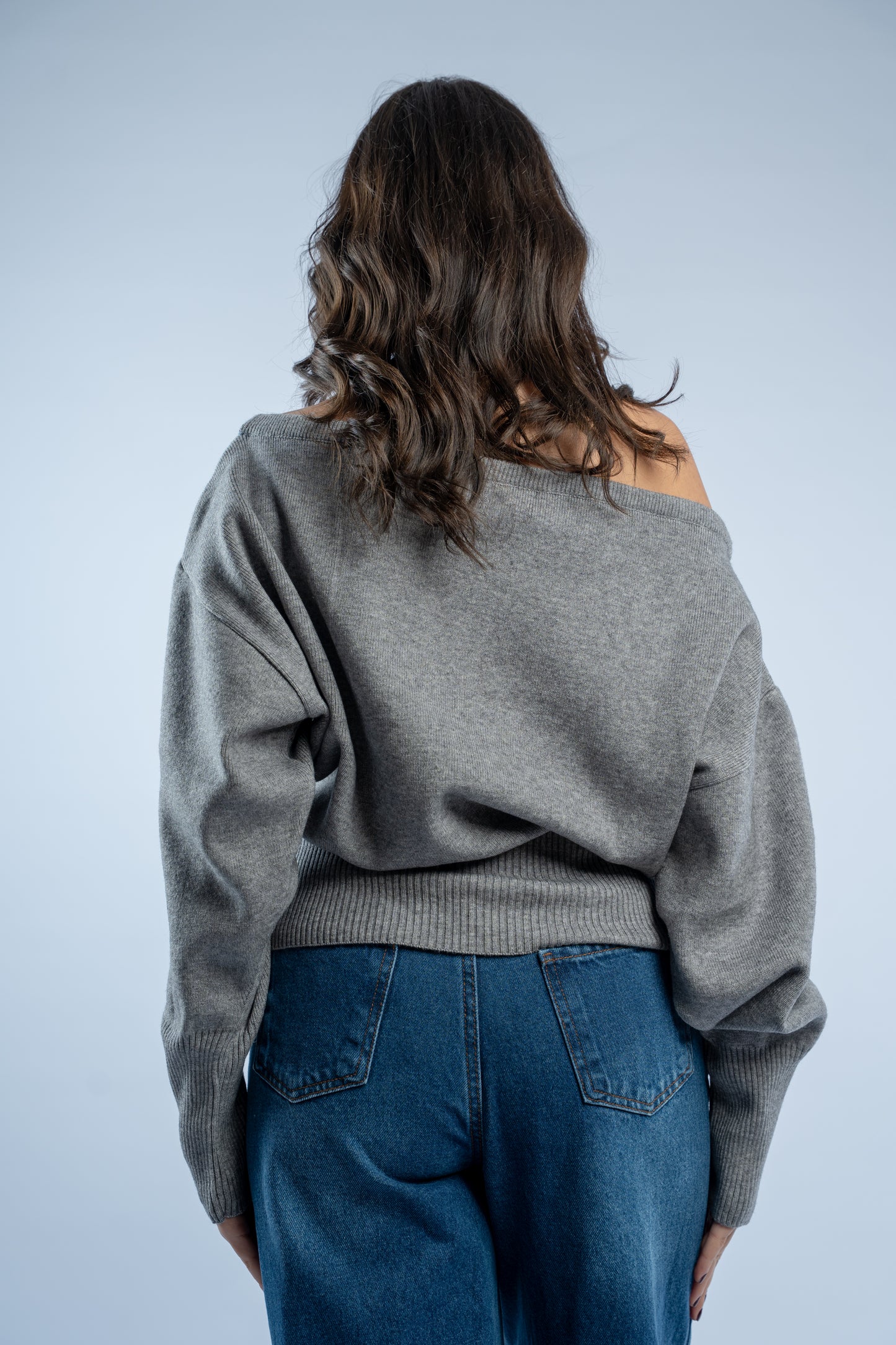 Asymmetrical waist-defined knit top