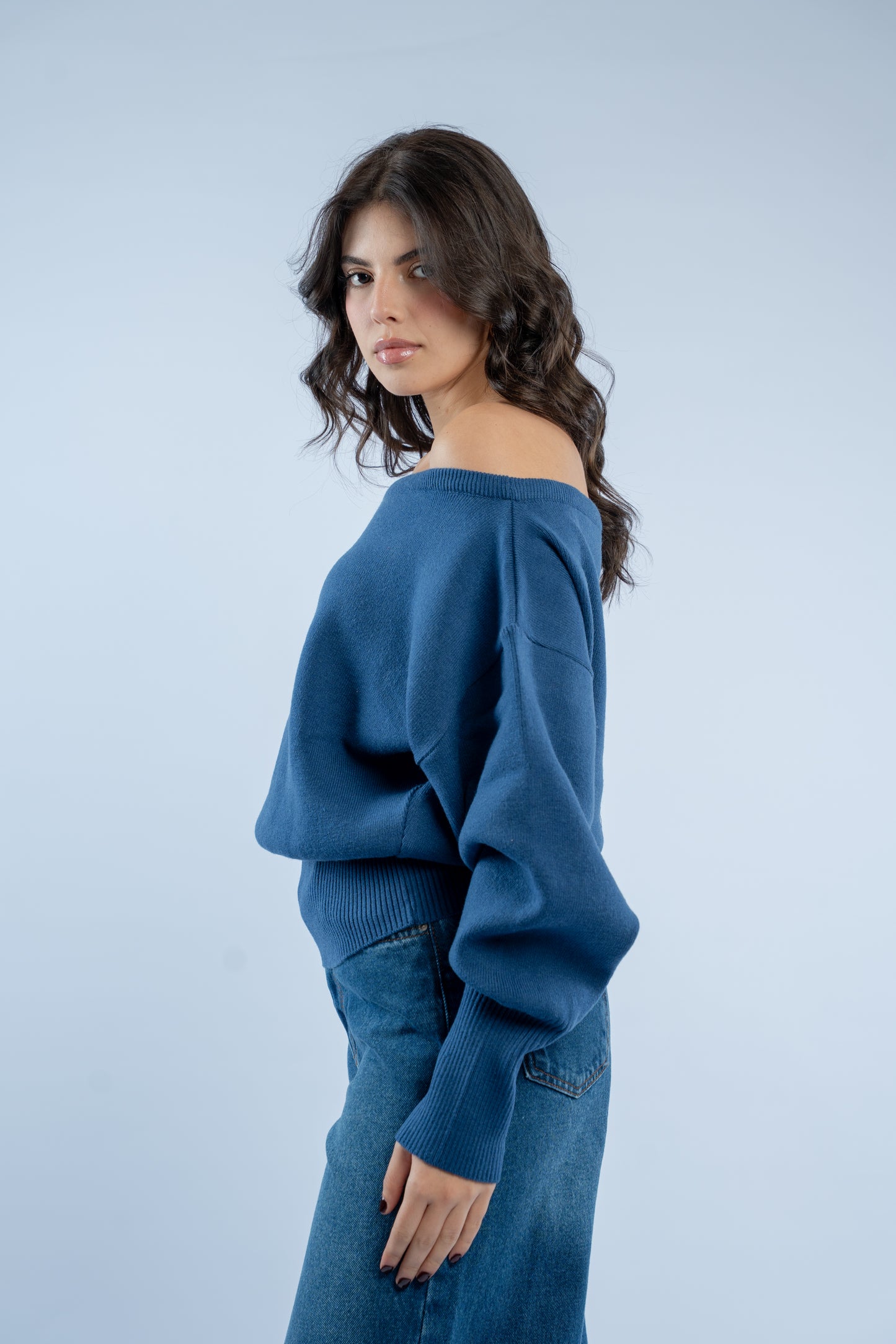 Asymmetrical waist-defined knit top