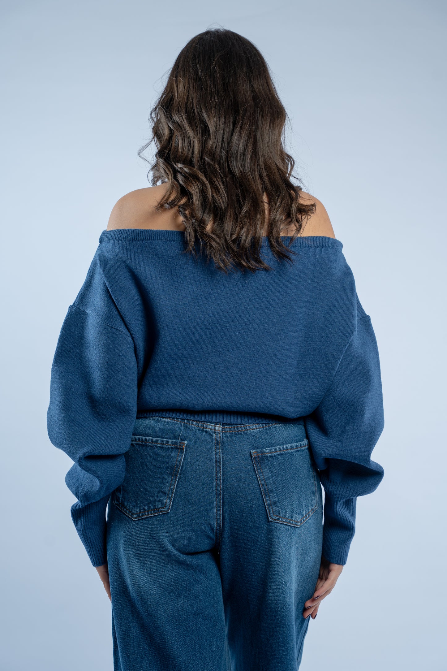 Asymmetrical waist-defined knit top